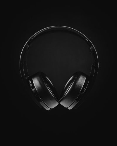 headphones, black background, product photography, simple, sleek, black and white, high contrast, hyper realistic, clean sharp focus, bokeh effect, minimalist, flat lay, studio lighting, no shadows, shot on Sony A7R IV --ar 51:64