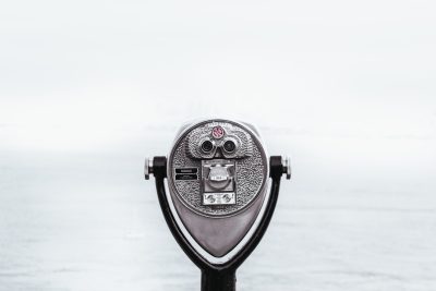 A gray coin viewer with the ocean in view, white background, minimalistic --ar 128:85