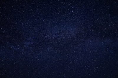 A dark night sky full of stars was captured in high resolution. The background is a dark blue with no other elements visible except for the starry sky. It is a wide shot, taken from an eye-level perspective, showcasing the vastness and beauty of space. This photo was created using a Sony Alpha A7 III camera and has a high level of detail. The style of the photo is reminiscent of works in the style of artists who capture the beauty and vastness of space. --ar 128:85
