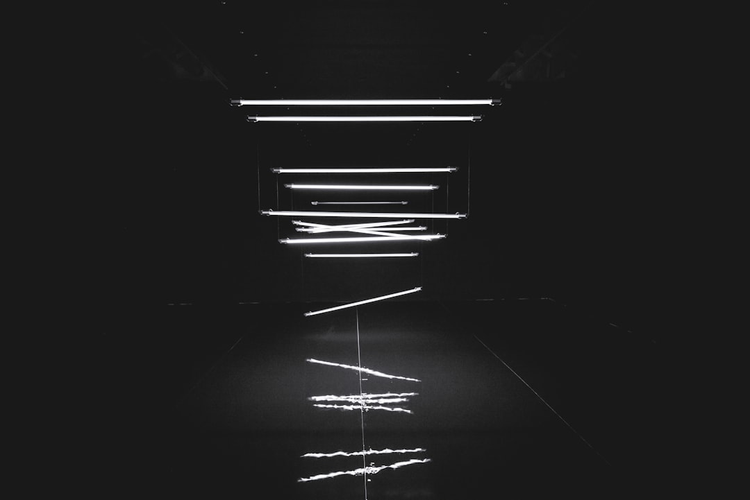 black background, white neon lines floating in the air, minimalism, dark room, black and white –ar 128:85