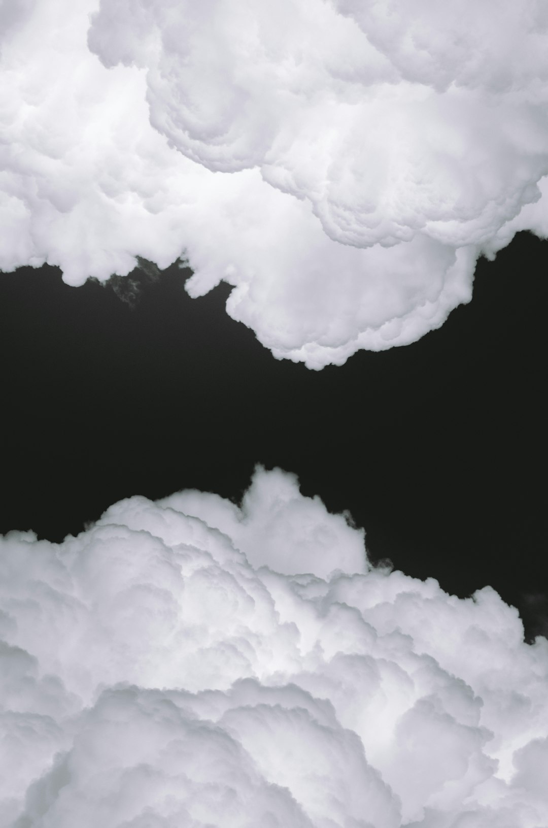White clouds on a black background, hyper realistic close up photography in the style of realism. –ar 21:32