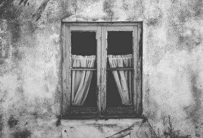 Black and white photography of an old window with curtains, in the center of Alologues village in Provence France --ar 128:87