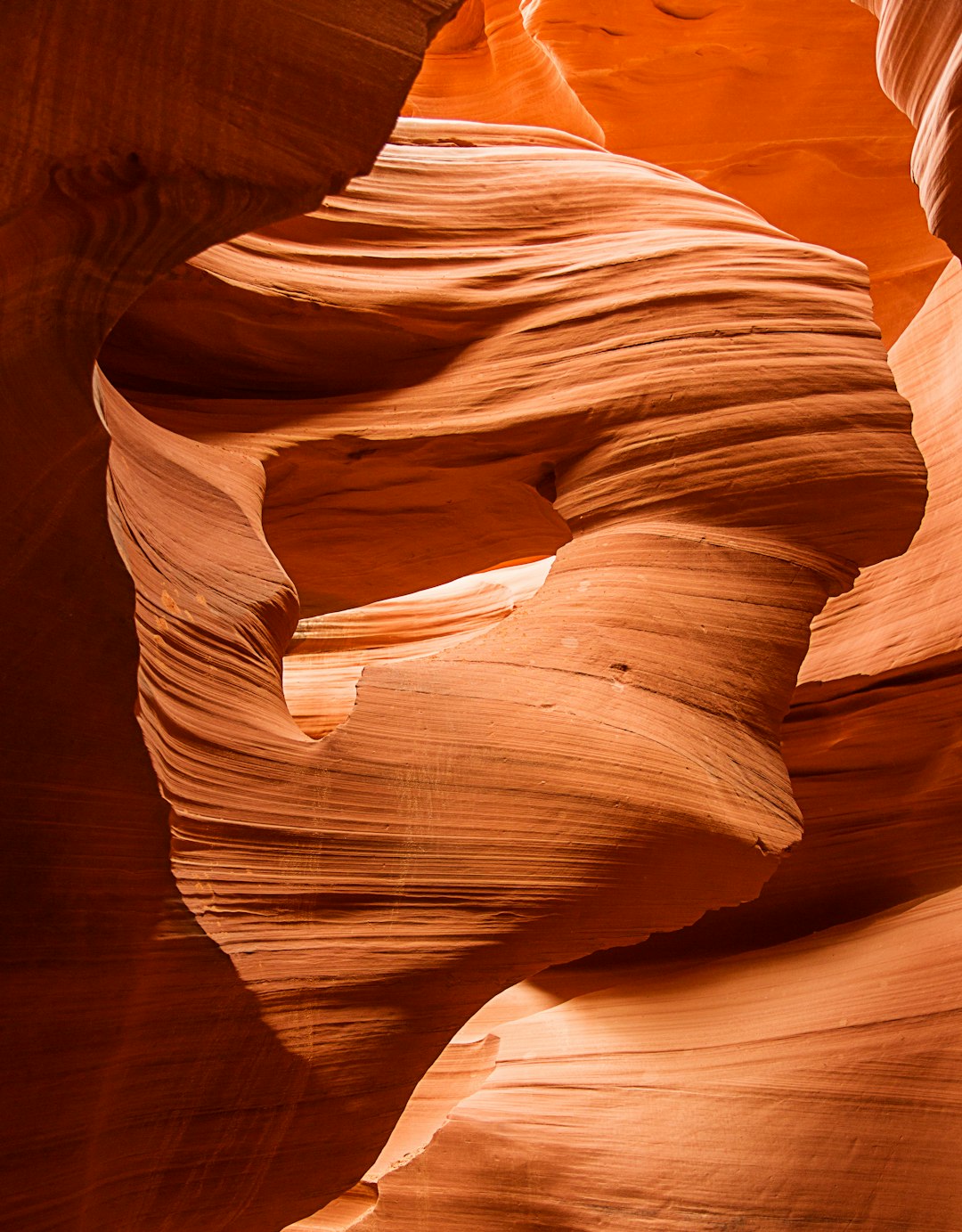 low angle photo of the inside of Antelope Canyon, a sandstone canyon in Lake Steak Mountain, Arizona with red and orange rock formations, warm lighting, smooth curves and sharp turns, close up, shot on Canon EOS5D Mark III camera –ar 25:32