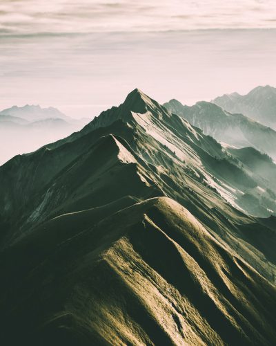 beautiful mountains, cinematic, shot from above, soft light, clean, muted color tones, in the style of NIKON D850 , minimalistic unsplash photography style --ar 51:64