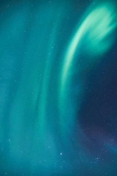 Beautiful northern lights in the sky, blue-green color. Stars in the background for a mobile phone wallpaper. Hyper realistic photography in the style of a professional photograph, with sharp focus and high resolution. Studio lighting and HDR were used to create a high quality image. --ar 85:128