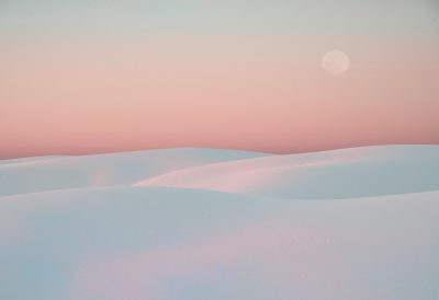 White dunes, pink sky and moon in the background, pastel colors, minimalist photography, ethereal landscape, cinematic --ar 128:87