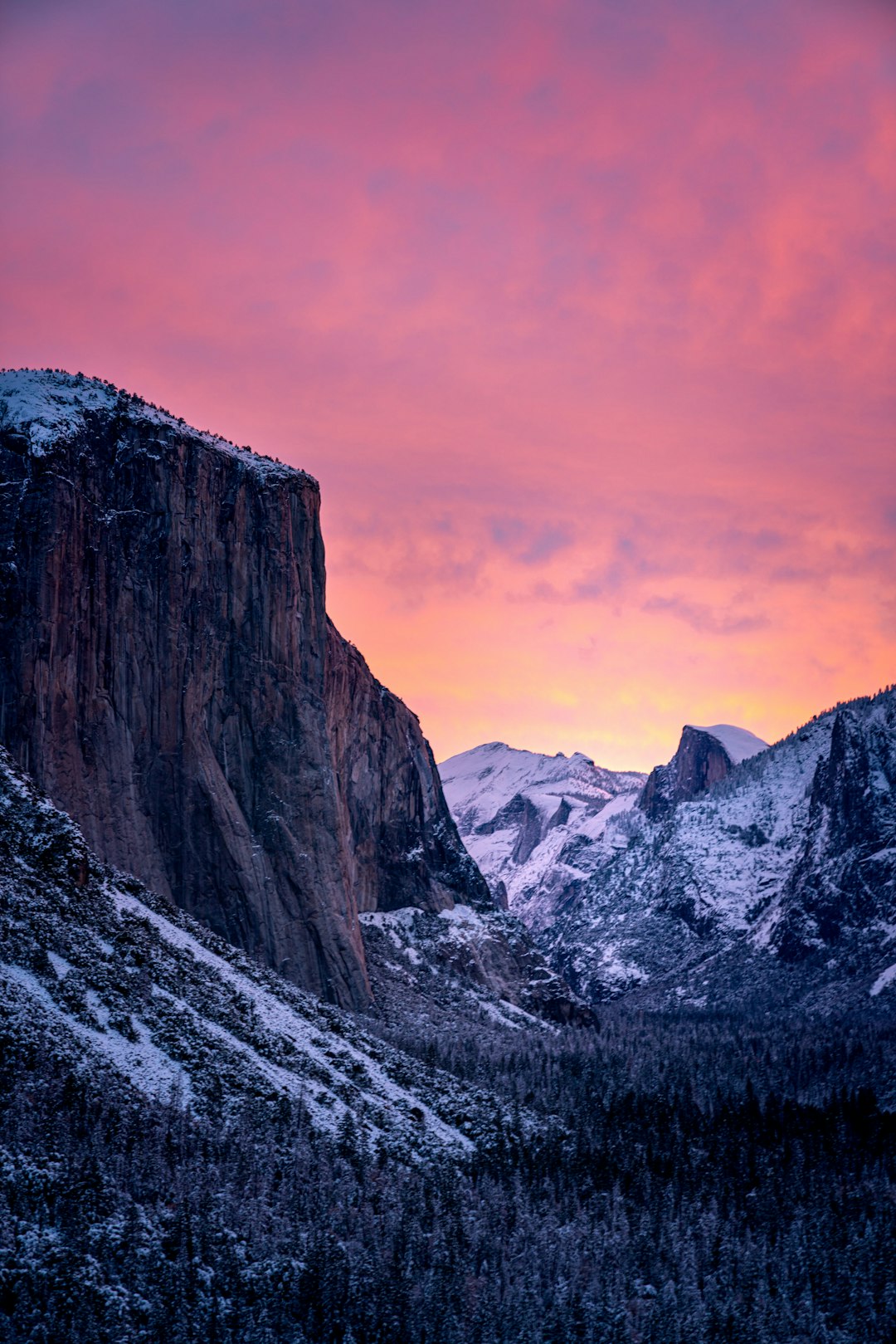 Yosemite National Park, snow-covered mountains under the pink sunset sky, in the style of Nikon D850. –ar 85:128