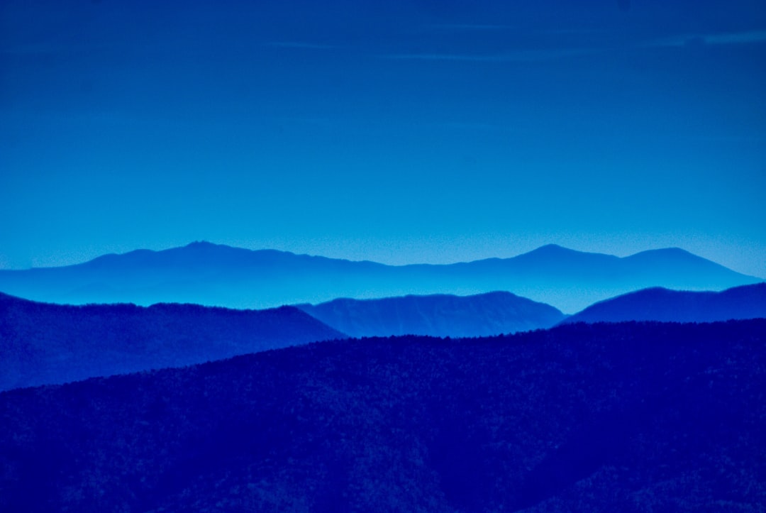 The silhouette of the Blue ridge mountains in an all blue gradient, shot on Leica M6 with f/2 lens –ar 128:85