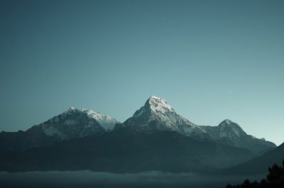 a cinematic still of the himalayan mountains at night, snowcapped peaks, beautiful and majestic, clear sky, shot on arri alexa with high quality film, stunning landscape, muted color grading --ar 32:21