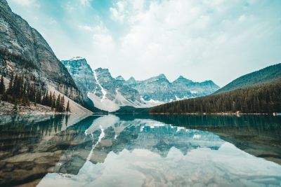 Beautiful lake with mountain range reflection in Canada, meets the sky, at Moraine Lake , shot on Sony Alpha A7 IV camera --ar 128:85