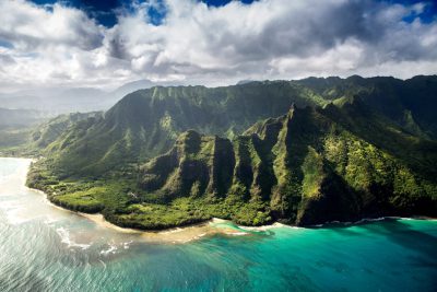 a wide angle aerial view photograph of the hawaii mountains and ocean, with lush greenery, cinematic photography style by [Roger Deakins](https://goo.gl/search?artist%20Roger%20Deakins) --ar 128:85