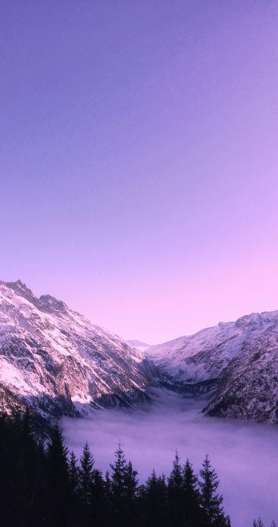 purple sky, foggy valley with snow covered mountains, phone wallpaper, nature photography, instagram, --ar 67:128