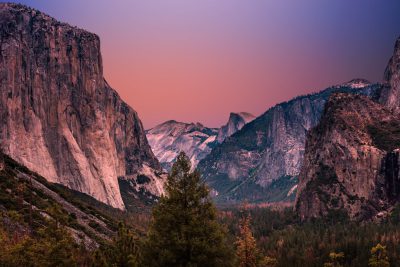 photograph of Yosemite Valley at dusk, pink sky, highly detailed, unsplash, in the style of Hasselblad H6D-400c --ar 128:85