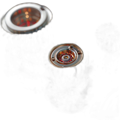 A closeup of the bottom view of two silver watch movements, one with red and orange lighting inside. The background is black, with soft light illuminating its details. A small aperture lens captures delicate textures and colors, presenting an elegant atmosphere. High resolution photography quality presents the details in the style of delicate textures and colors.