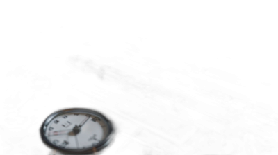 A very blurry photograph of an old clock on the left side, centered in the frame, on a black background, with low light photography and low contrast blurry details. The photograph is in the style of low light photography.